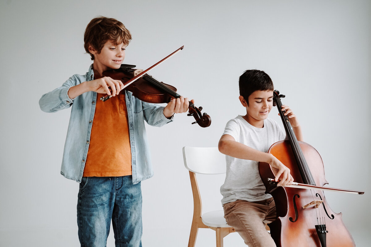 Violin and cello students playing together