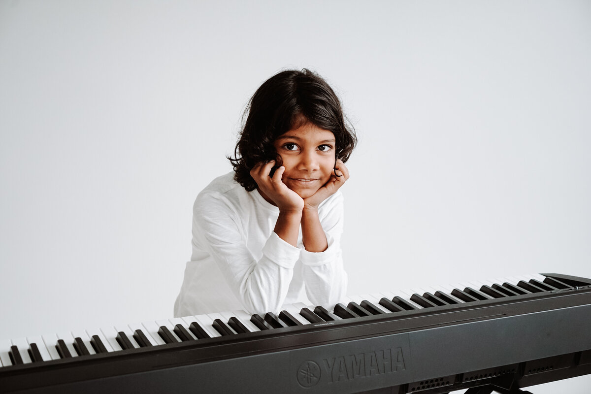 A Munster Music Academy piano student at a keyboard