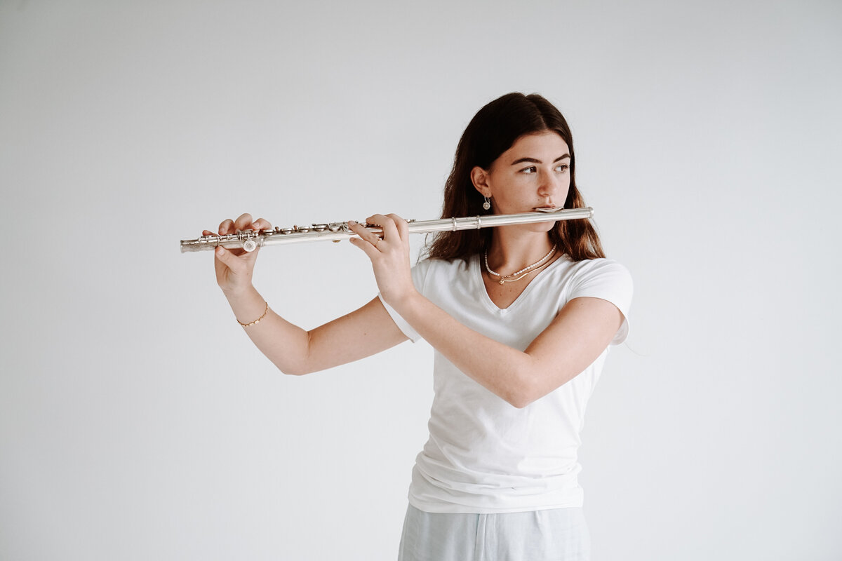 A young musician with a woodwind instrument